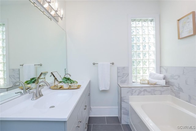 6 S Rowland St, Richmond, VA 23220 - full bathroom featuring tile patterned floors, a garden tub, and vanity