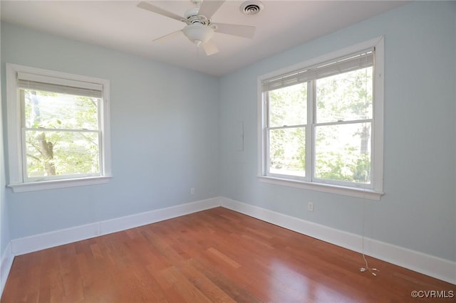 6 S Rowland St, Richmond, VA 23220 - unfurnished room featuring plenty of natural light, visible vents, baseboards, and wood finished floors