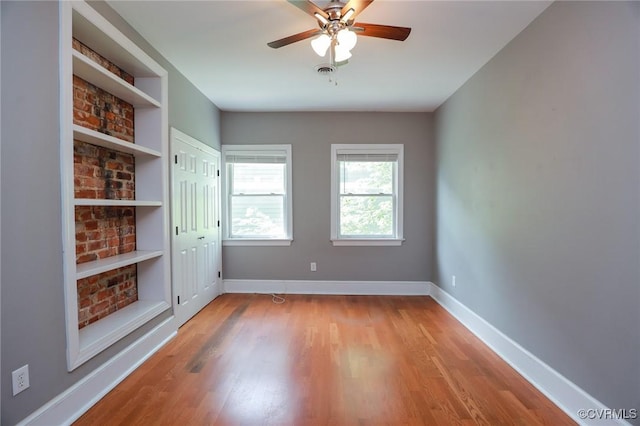 6 S Rowland St, Richmond, VA 23220 - unfurnished room featuring wood finished floors, visible vents, a ceiling fan, and baseboards