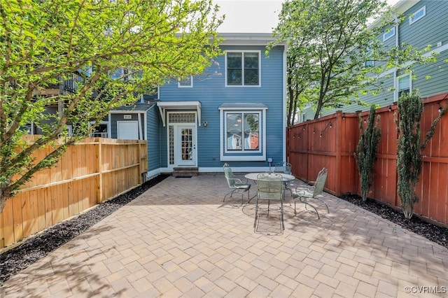 6 S Rowland St, Richmond, VA 23220 - rear view of house with a fenced backyard, a patio area, and entry steps