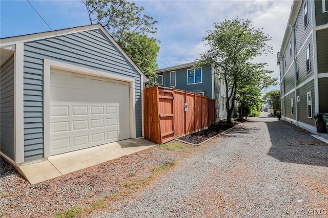 6 S Rowland St, Richmond, VA 23220 - detached garage featuring fence and dirt driveway