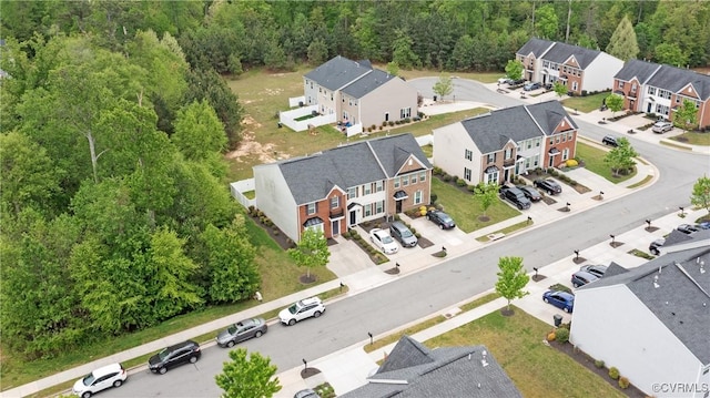 bird's eye view featuring a residential view and a forest view