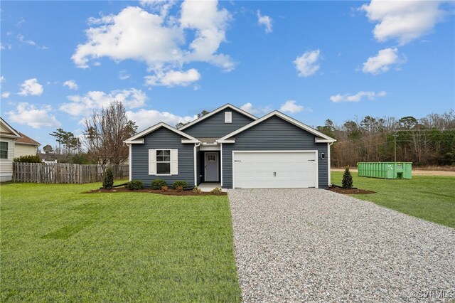 ranch-style home with an attached garage, driveway, fence, and a front yard