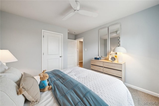 bedroom with carpet, a ceiling fan, and baseboards