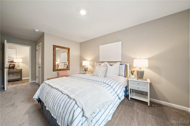 carpeted bedroom with baseboards