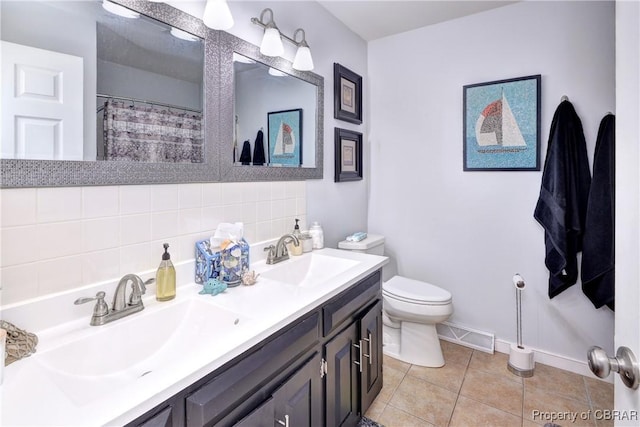 full bathroom with tile patterned flooring, visible vents, toilet, a sink, and baseboards