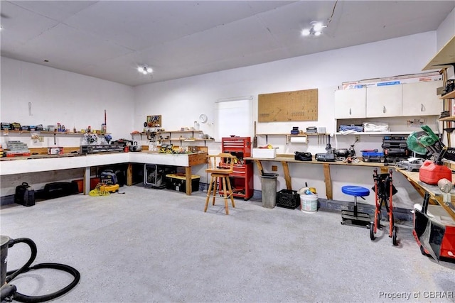 miscellaneous room with a workshop area