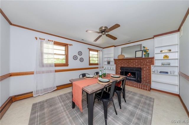 8000 N Courthouse Rd, New Kent, VA 23124 - dining room with light colored carpet, built in shelves, a brick fireplace, a ceiling fan, and crown molding