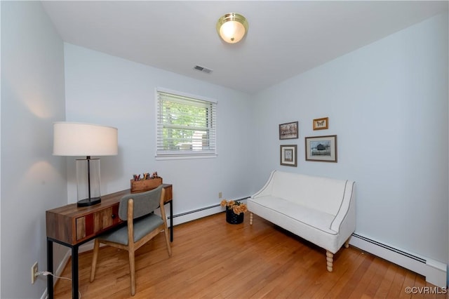 8000 N Courthouse Rd, New Kent, VA 23124 - sitting room with visible vents, baseboard heating, and light wood-style floors