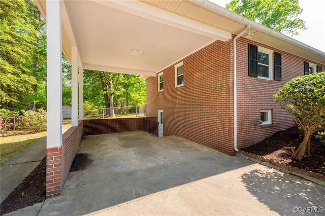 exterior space with a carport