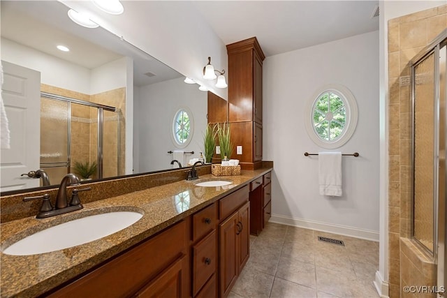 7208 Cornus Ave, Chesterfield, VA 23832 - bathroom with visible vents, a sink, and a shower stall