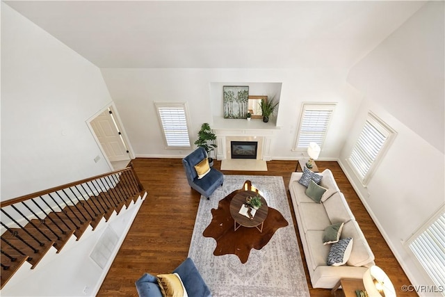 7208 Cornus Ave, Chesterfield, VA 23832 - living area featuring a glass covered fireplace, baseboards, stairs, and wood finished floors