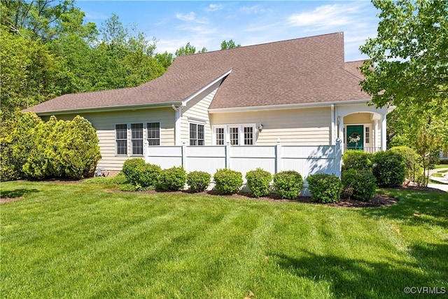 7208 Cornus Ave, Chesterfield, VA 23832 - back of property featuring a lawn, a shingled roof, and fence