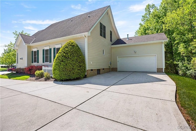 7208 Cornus Ave, Chesterfield, VA 23832 - view of side of property with a garage, crawl space, a shingled roof, and concrete driveway