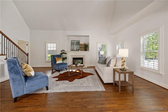 7208 Cornus Ave, Chesterfield, VA 23832 - living room featuring dark wood finished floors, high vaulted ceiling, and stairway