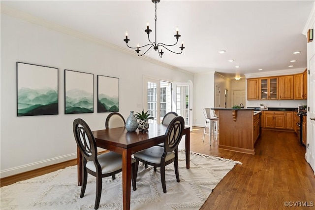 7208 Cornus Ave, Chesterfield, VA 23832 - dining space with baseboards, an inviting chandelier, ornamental molding, recessed lighting, and dark wood-type flooring