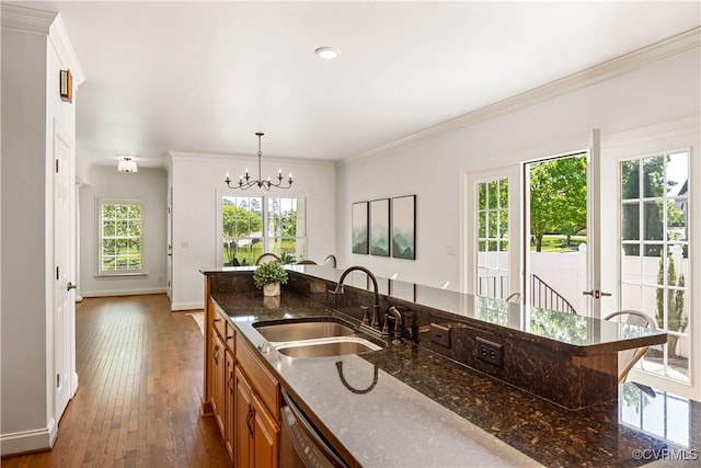 7208 Cornus Ave, Chesterfield, VA 23832 - kitchen with dark wood-style flooring, baseboards, dishwashing machine, a chandelier, and a sink