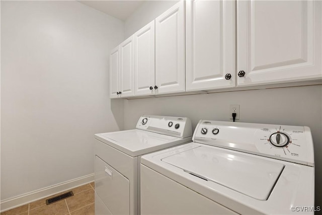 7208 Cornus Ave, Chesterfield, VA 23832 - laundry room with cabinet space, light tile patterned flooring, baseboards, visible vents, and washer and clothes dryer