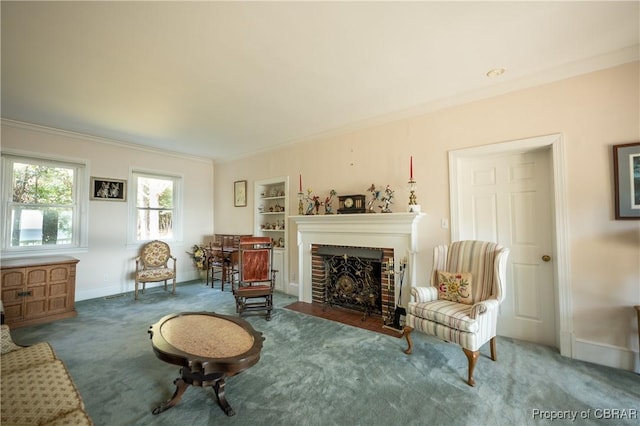 living area featuring a fireplace with flush hearth, carpet, ornamental molding, baseboards, and built in shelves