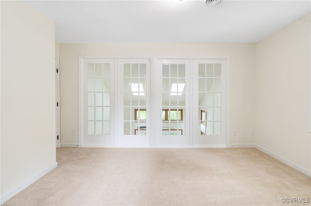 spare room with carpet floors and baseboards