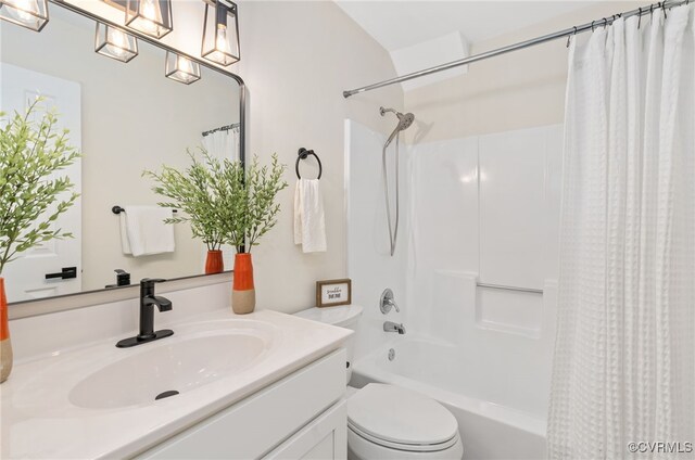 bathroom featuring shower / tub combo with curtain, vanity, and toilet