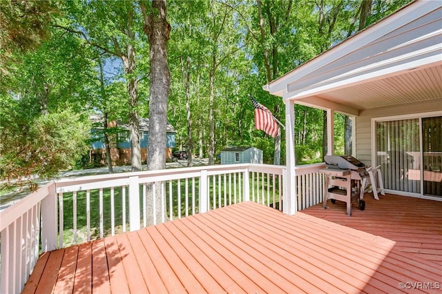 wooden deck with an outbuilding and a storage shed