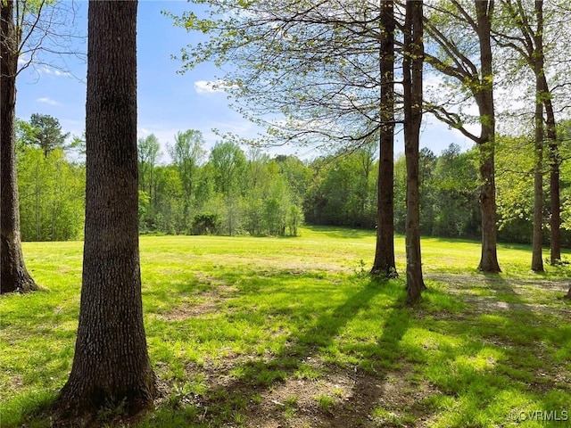 view of landscape with a wooded view