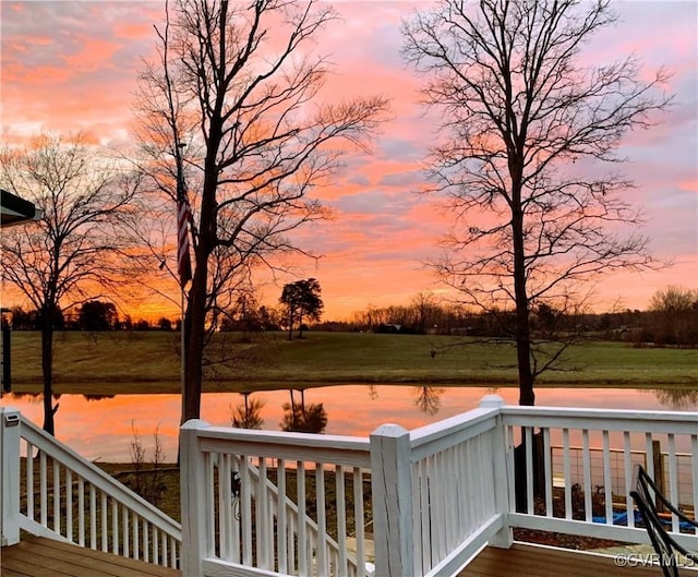 deck at dusk with a water view