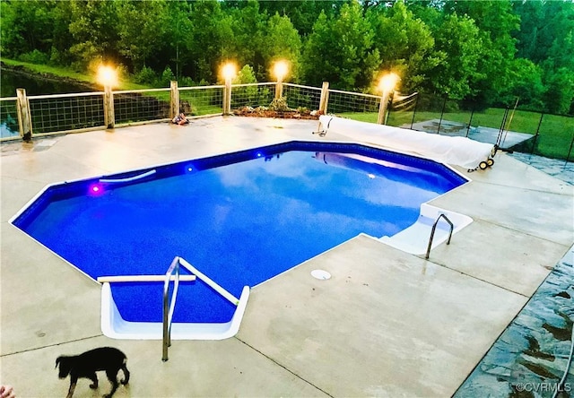 view of swimming pool with fence, a patio area, and a fenced in pool