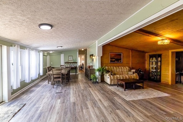 living room featuring wood finished floors and a textured ceiling