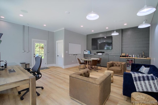 living room with light wood-style floors, bar, baseboards, wine cooler, and recessed lighting