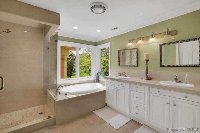 bathroom with a sink, visible vents, and a stall shower