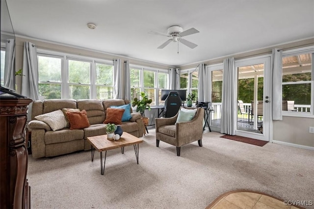 sunroom / solarium with crown molding, carpet floors, and baseboards