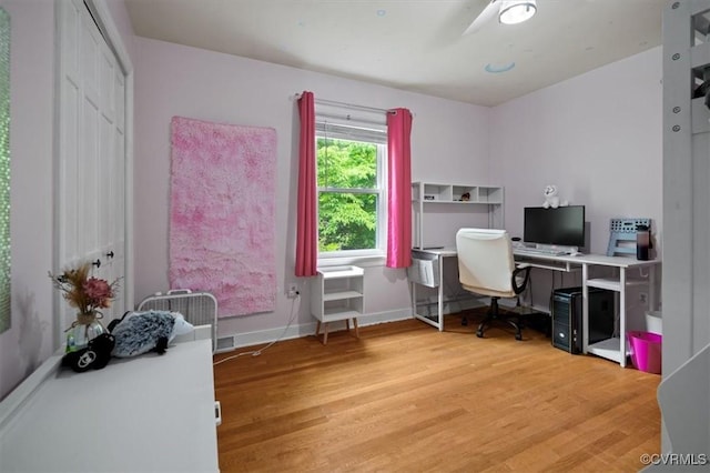 home office with wood finished floors, baseboards, and ceiling fan