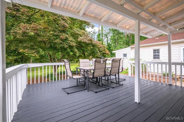 deck featuring outdoor dining area