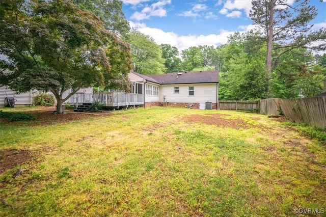 view of yard with a wooden deck and cooling unit