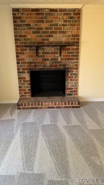 501 Faye St, Richmond, VA 23225 - details with baseboards, a brick fireplace, carpet flooring, and ornamental molding