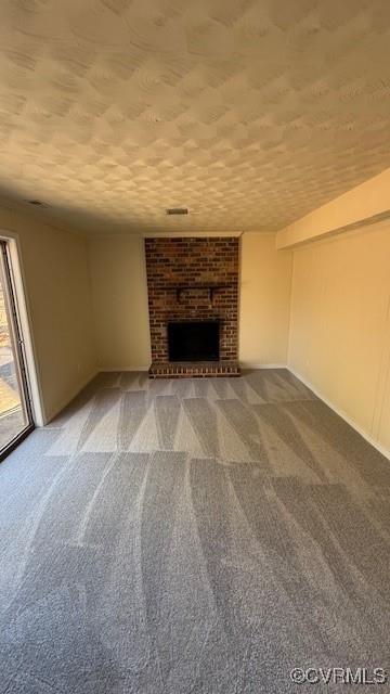 501 Faye St, Richmond, VA 23225 - unfurnished living room featuring carpet and a fireplace