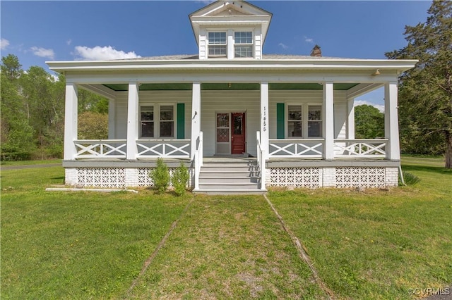 view of front of property featuring a front lawn and covered porch