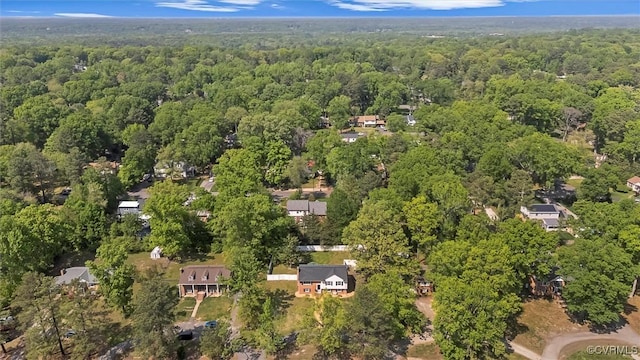 drone / aerial view featuring a view of trees