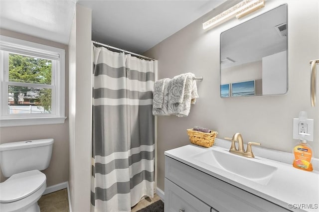 full bath with vanity, tile patterned floors, toilet, visible vents, and baseboards