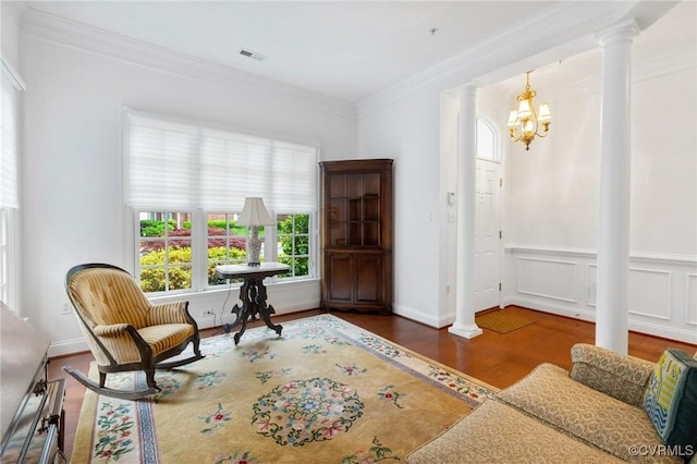 9522 Nassington Ct, Henrico, VA 23229 - sitting room with decorative columns, a chandelier, wood finished floors, and crown molding
