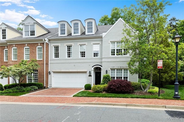 9522 Nassington Ct, Henrico, VA 23229 - view of front of house featuring a garage, brick siding, and driveway