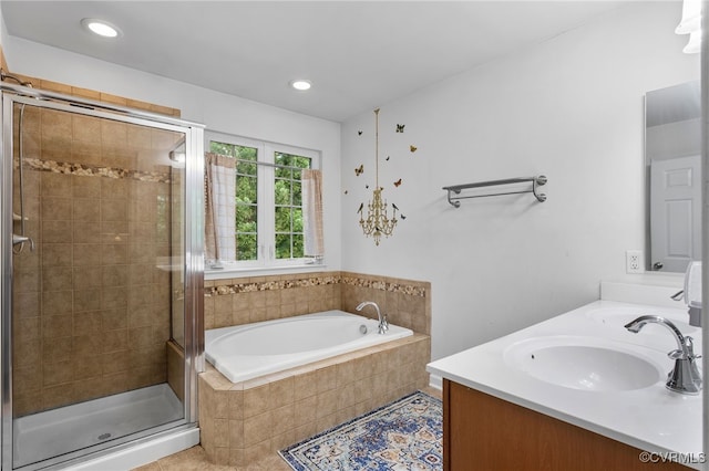 bathroom with a sink, a shower stall, recessed lighting, and a garden tub
