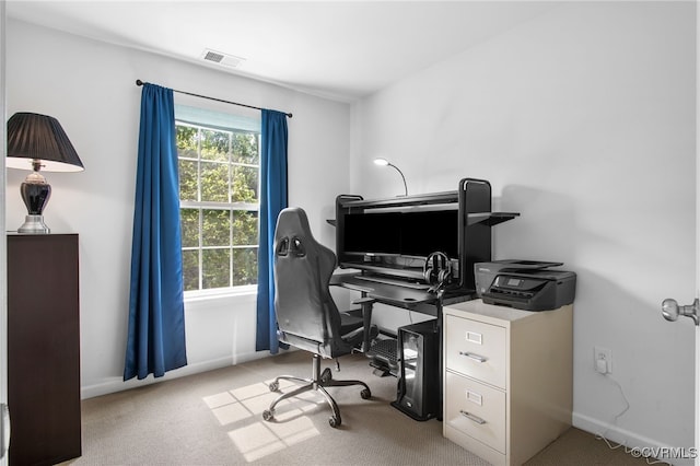 home office with baseboards, a wealth of natural light, carpet flooring, and visible vents