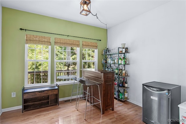 home office featuring baseboards and wood finished floors