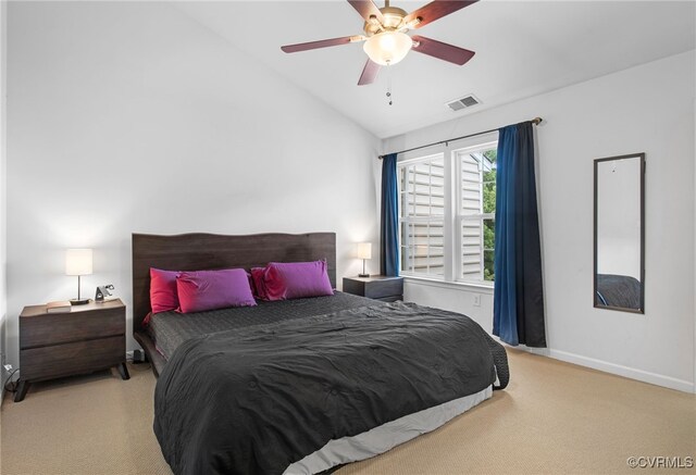 carpeted bedroom featuring visible vents, baseboards, ceiling fan, and vaulted ceiling