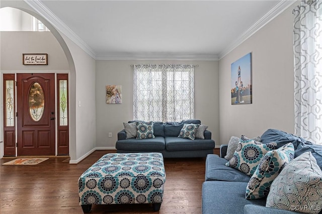 living room featuring wood finished floors, crown molding, baseboards, and arched walkways