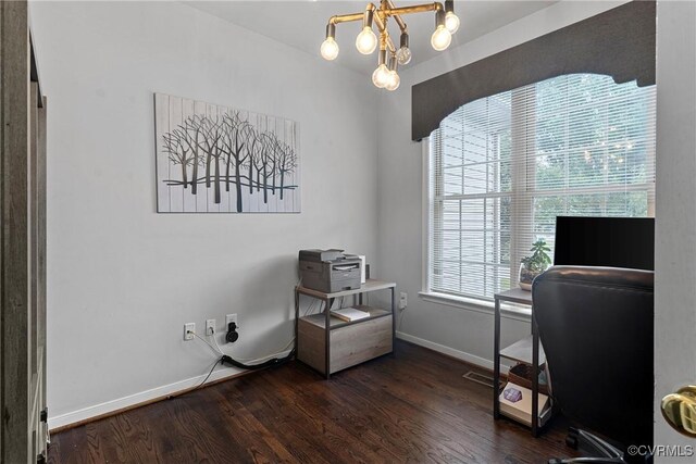 office area with baseboards, wood finished floors, and a chandelier