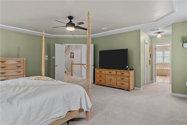 bedroom featuring ceiling fan, visible vents, ensuite bathroom, baseboards, and light carpet
